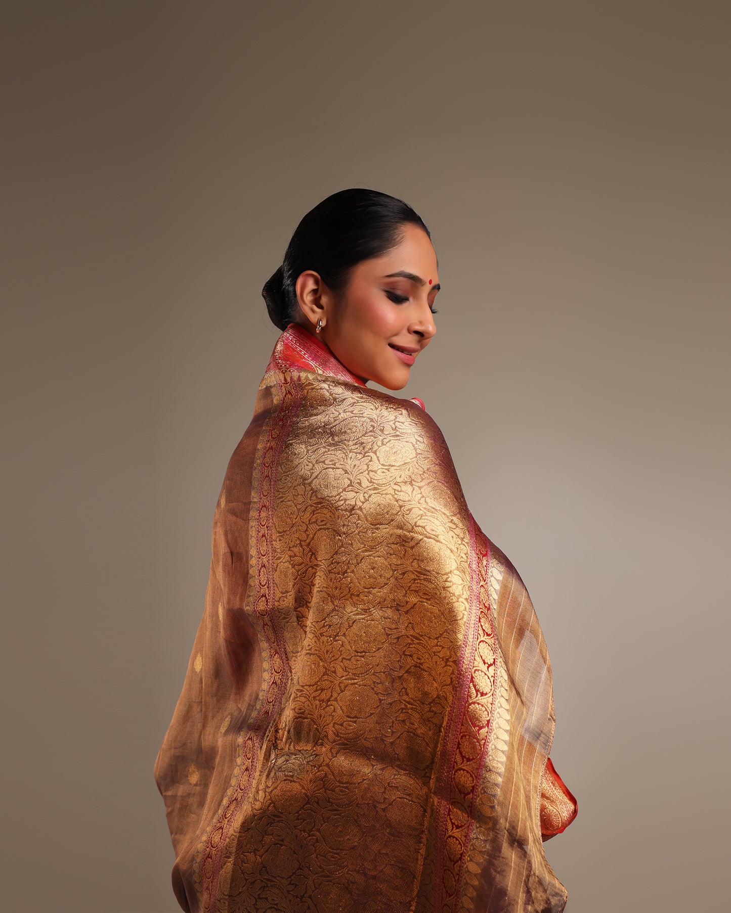 Pure Katan Tissue Metallic Payne Grey Saree with Gold Kadwa Buta and Raspberry Pink, and Gold Motif Border