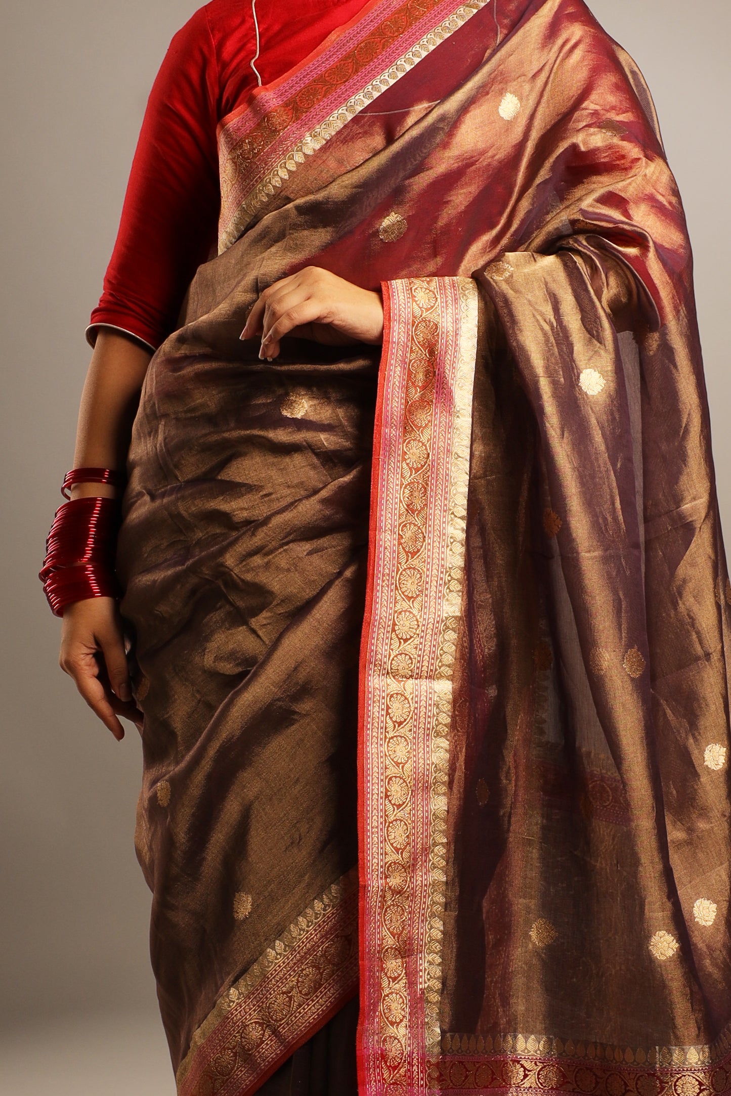 Pure Katan Tissue Metallic Payne Grey Saree with Gold Kadwa Buta and Raspberry Pink, and Gold Motif Border